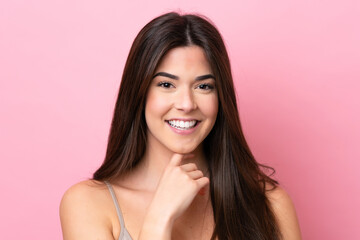 Young Brazilian woman isolated on pink background . Portrait