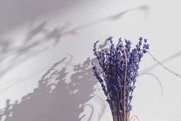 dried lavender bouquet with hands - obrazy, fototapety, plakaty