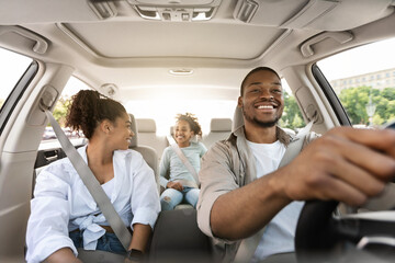 Happy African American Family Driving New Automobile Having Ride Outdoor