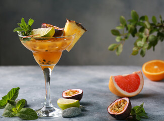 Summer. Drinks and beverage. Fruit exotic tropical cocktail with pineapple, passion fruit,...