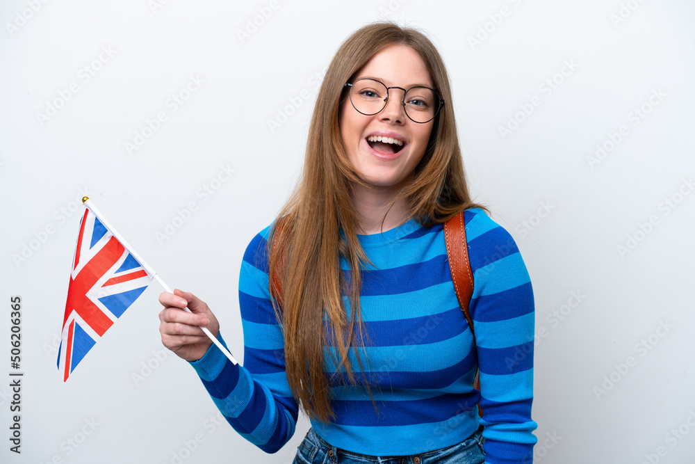 Wall mural Young caucasian woman holding an United Kingdom flag isolated on white background with surprise facial expression