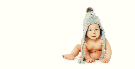 Happy cute little baby sitting in hat on the floor on white background, banner blank copy space for advertising text