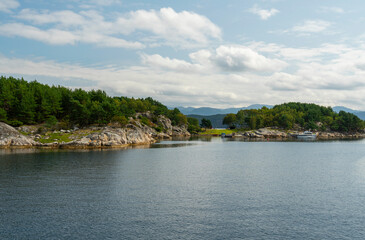 Fototapeta na wymiar Lysefjord green sea mountain shore, Norway