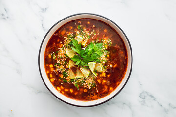healthy plant-based food, vegan mexican-inspired soup with red kindey beans corn and coriander in spicy tomato soup