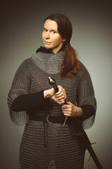 Medieval infantry armed woman dressed in chain armor