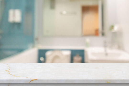Empty white marble table top with blur bathroom background