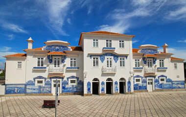 Historic building of old Aveiro Railway station ornamented with typical blue azulejos tile...