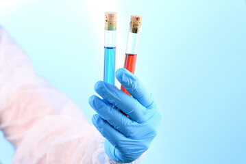 Chemical laboratory preparation in the form of blue and red liquid in a test tube.