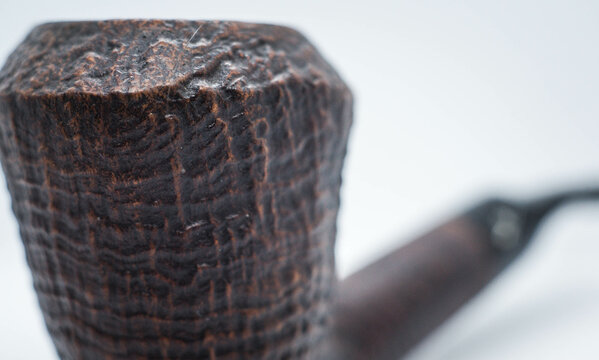 Part of a sandblasted pipe with blurry background 1