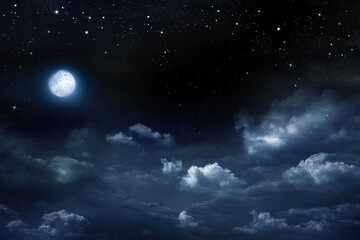 Beautiful dark night sky with clouds and fullmoon and stars