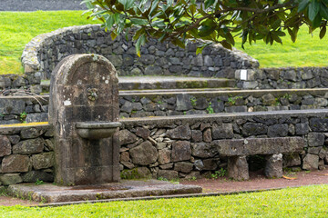 Drinking fountain with faucet and sink in public park