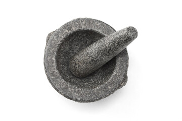 Stone mortar and pestle on white