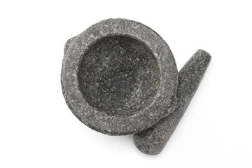 Stone mortar and pestle on white