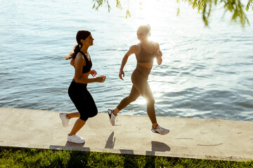 Young woman taking running exercise by the river promenade