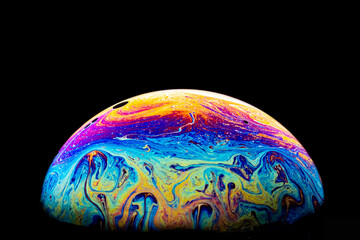 Soap bubble against a black background