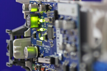 Electronic control board with green LED turned on close-up.