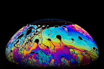 Soap bubble against a black background