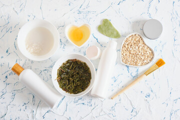 ingredients for home cosmetics, natural cosmetics concept, rice water, tea infusion, raw egg and oatmeal