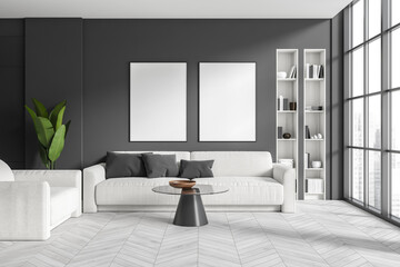 Dark living room interior with two empty white posters