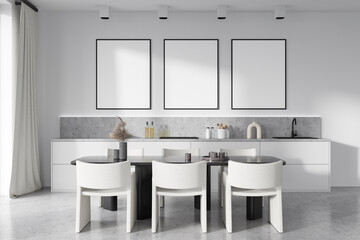 Bright kitchen room interior with three empty white posters