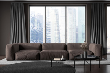 Dark living room interior with sofa and coffee table, panoramic window
