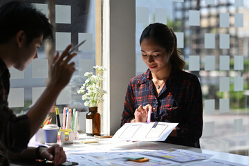 Asian businesswoman sharing a new project's idea with his partner, Business and technology, Development in Ux Ui topics.