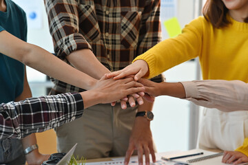 Close-up of office worker's hands are united in action and spirit for their project. Business and financial concepts.