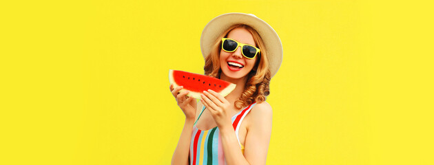 Summer portrait of happy laughing woman with fresh slice of watermelon wearing straw hat, sunglasses on yellow background, blank copy space for advertising text
