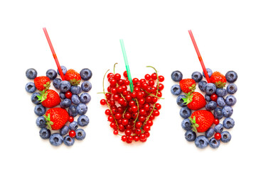 Berries in the shape of a glass for making enriched drinks on a white background. The concept of maintaining immunity.