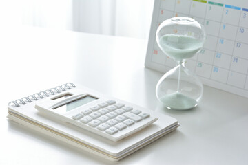 Hourglass on a white desk