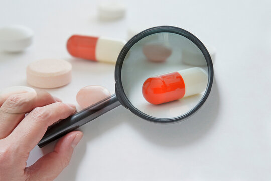 Magnifying glass and capsule medicine