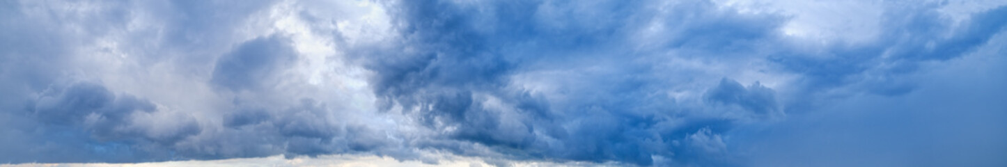 Fototapeta premium Dramatic cloudy sky with thunderstorm clouds. Natural weather and climate sky panoramic background scene.