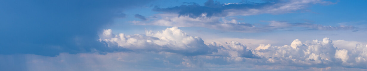Fototapeta na wymiar White cumulus clouds in blue sky panoramic high resolution background