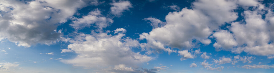 White cumulus clouds in blue sky high resolution background