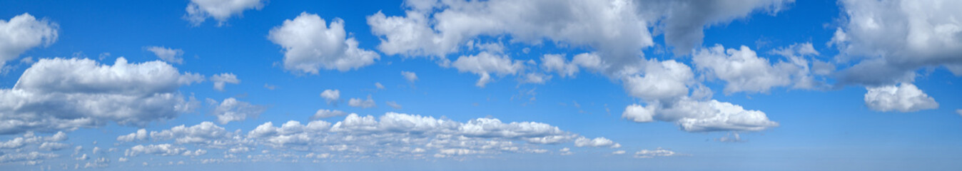 Naklejka na ściany i meble Blue sky with clouds in sunshine (wide natural cloudscape background panorama)