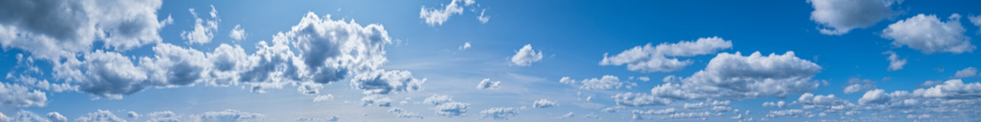 Fototapeta premium Blue sky with clouds in sunshine (wide natural cloudscape background panorama)