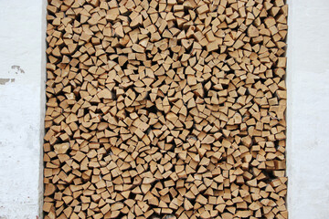 Wooden background or texture for your interior design. Chopped birch firewood