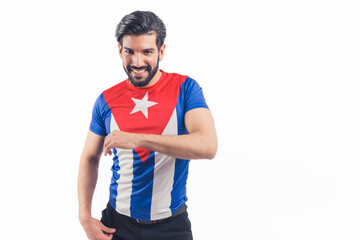Handsome Latin man dancing salsa rumba while wearing a t-shirt with cuba's flag. High quality photo