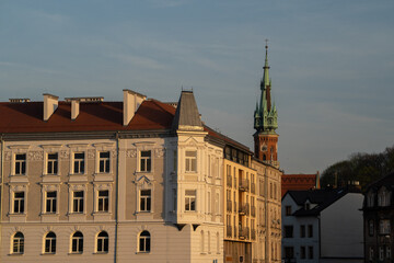the facade of tenement houses near the Bernatka footbridge, in the background the Church of St. Joseph in Cracow