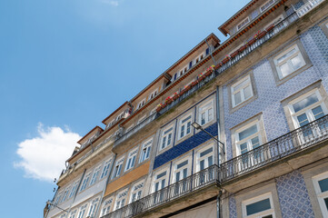 Facades of houses with tiles in the city of Porto in the summer of 2022.