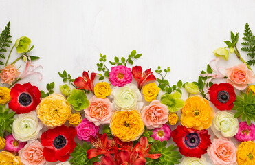 Fototapeta na wymiar Beautiful flowers composition. Arrangement of anemones, roses, ranunculus, tropical flowers, succulent and leaves on light background.