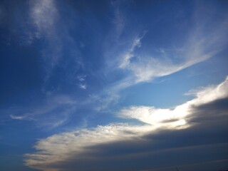 sunset light behind the stratocumulus cloud and blue sky