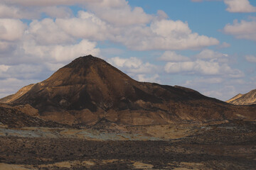 Panoramic View to the Sandy Hills in the Black Desert, is National park in the Farafra Oasis, Egypt
