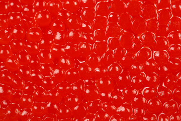 Red caviar closeup texture background or wallpaper