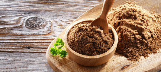 Composition with a bowl of ground coriander