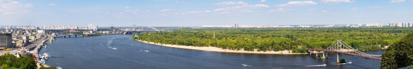 Fototapeta premium summer panorama of the city of Kyiv, Ukraine, the Dnieper river, bridges across the river and the coastline