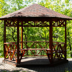 Wooden gazebo in the park.