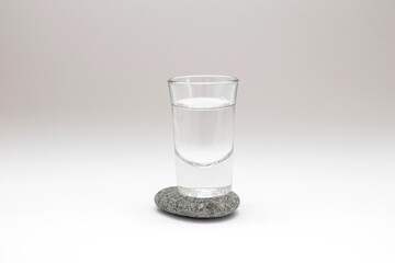 Shot of drink on stone