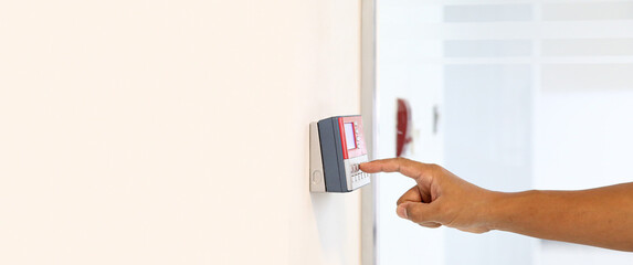 Proximity card reader door unlock, Close up hand security man using fingerprint scanning on access...