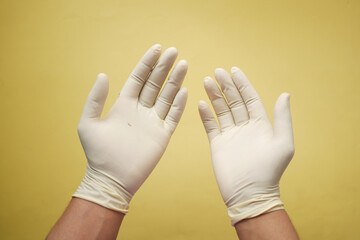 man doctor wears medical gloves, close up